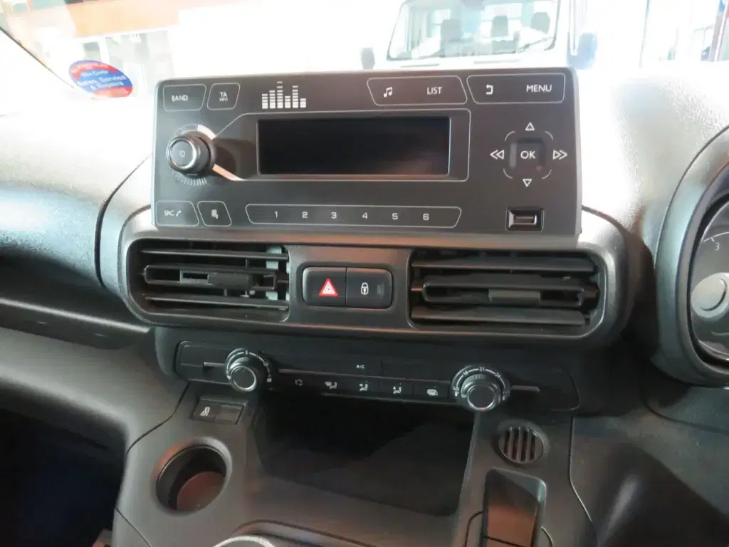 White Vauxhall Combo.