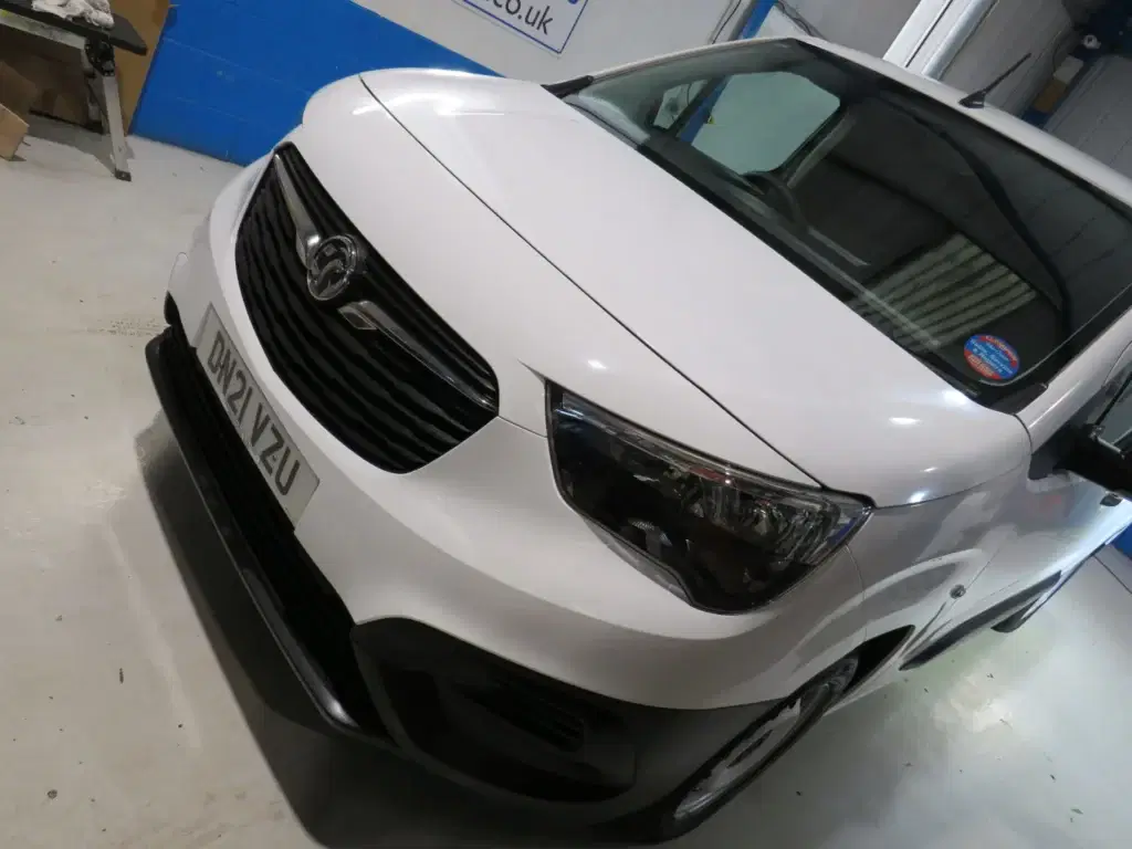 White Vauxhall Combo.