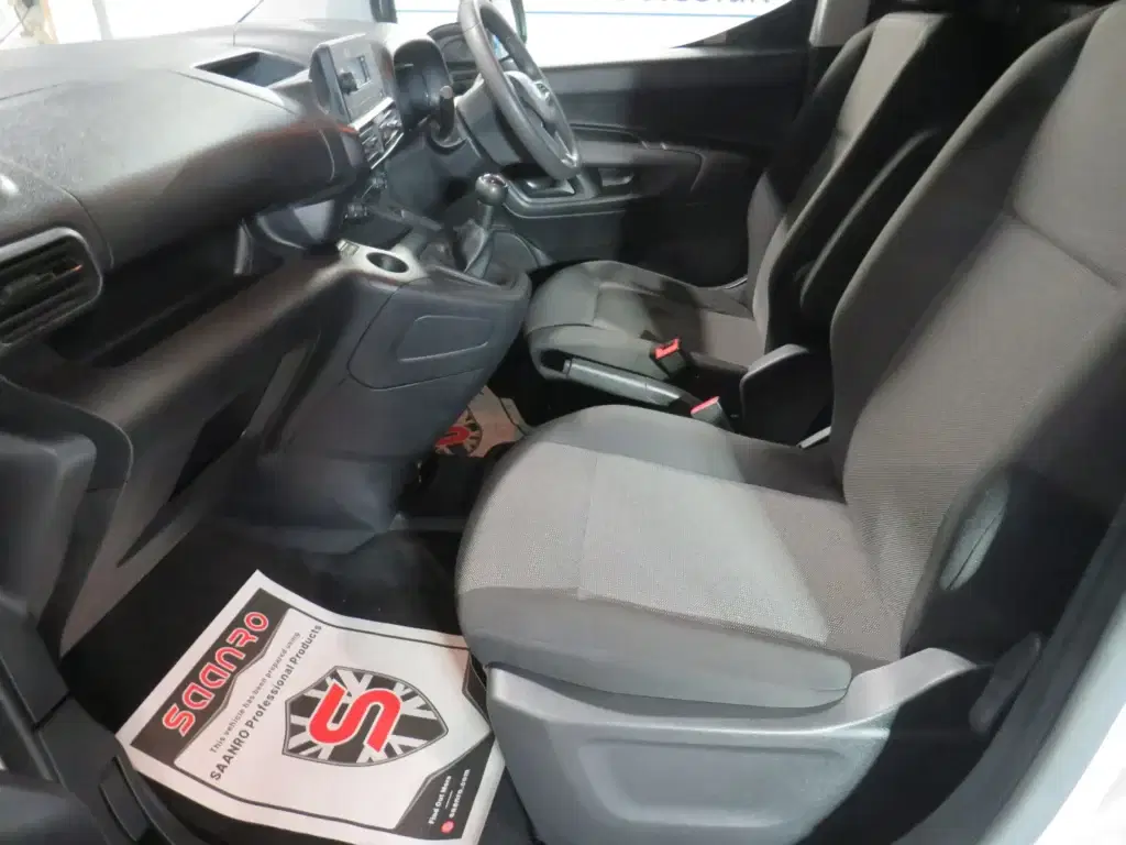 White Vauxhall Combo.