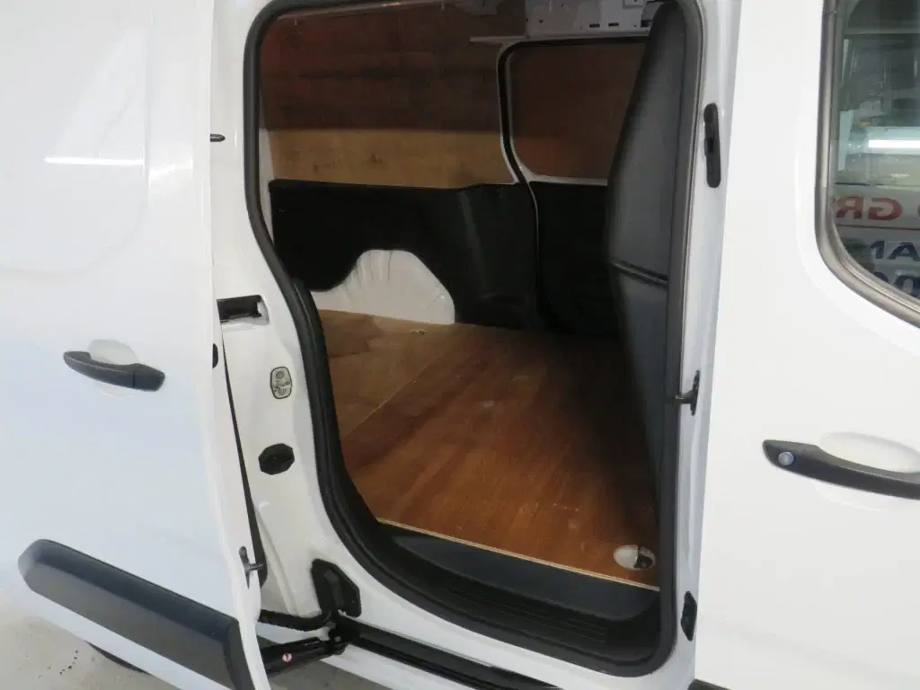 White Vauxhall Combo.