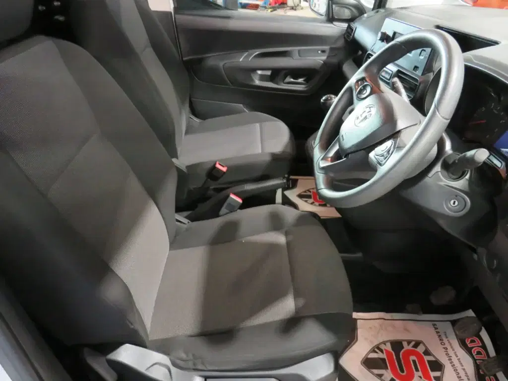 White Vauxhall Combo.