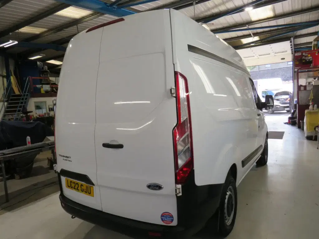 White Ford Transit Custom.