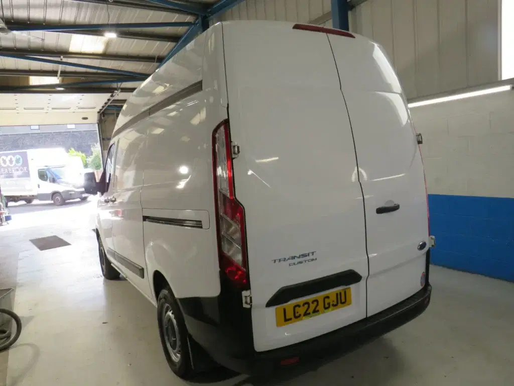 White Ford Transit Custom.