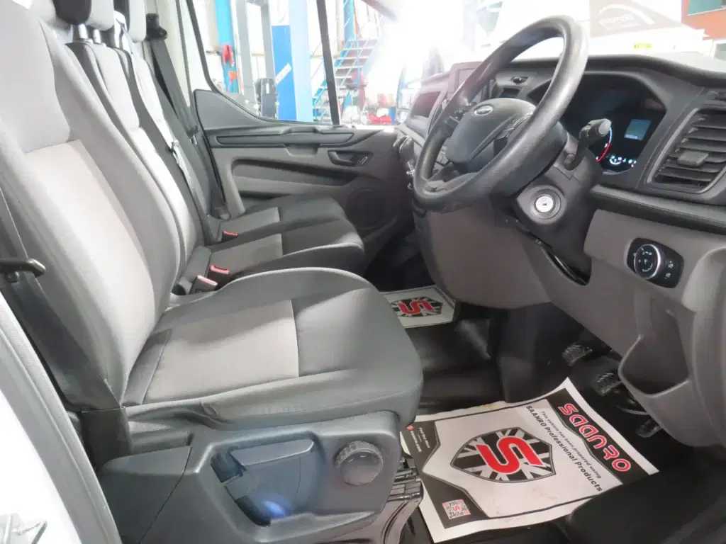 White Ford Transit Custom.