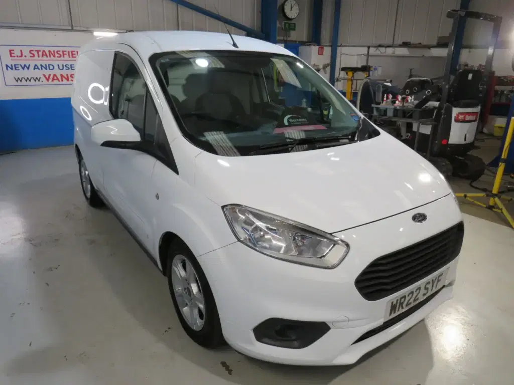 White Ford Transit Courier.
