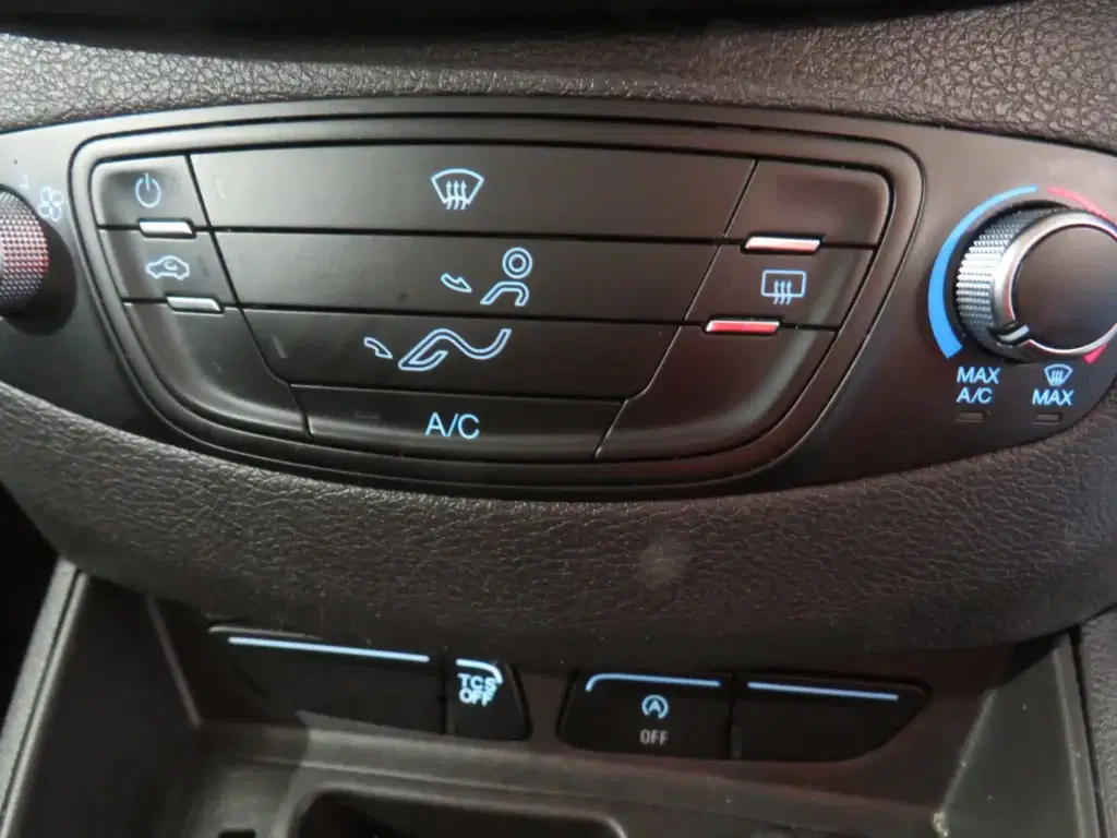 White Ford Transit Courier.