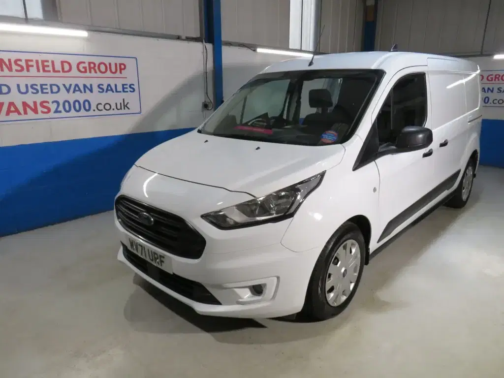 White Ford Transit Connect.