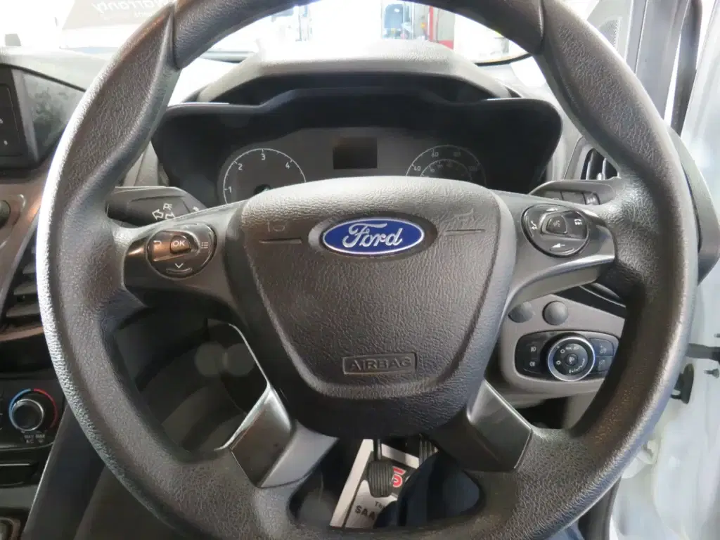 White Ford Transit Connect.