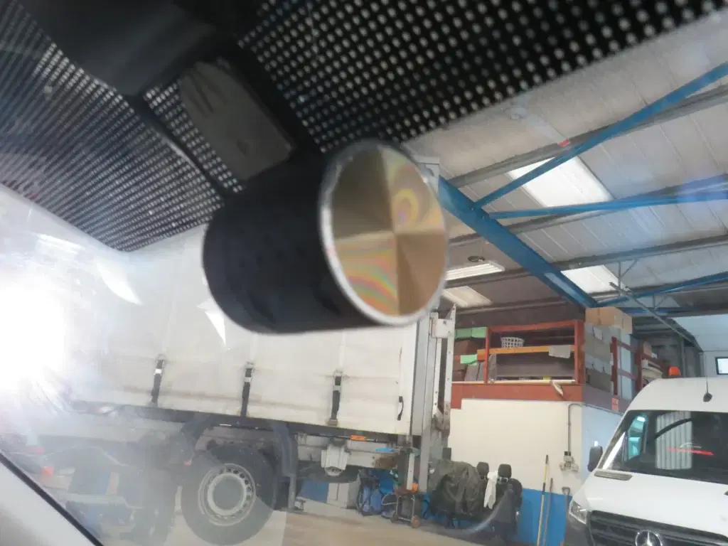 White Ford Transit Connect.