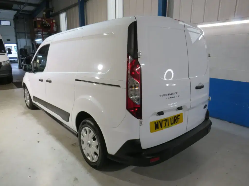 White Ford Transit Connect.