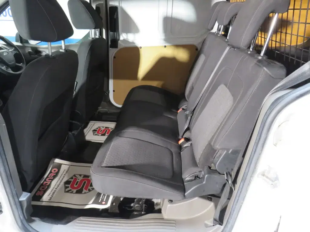 White Ford Transit Connect.