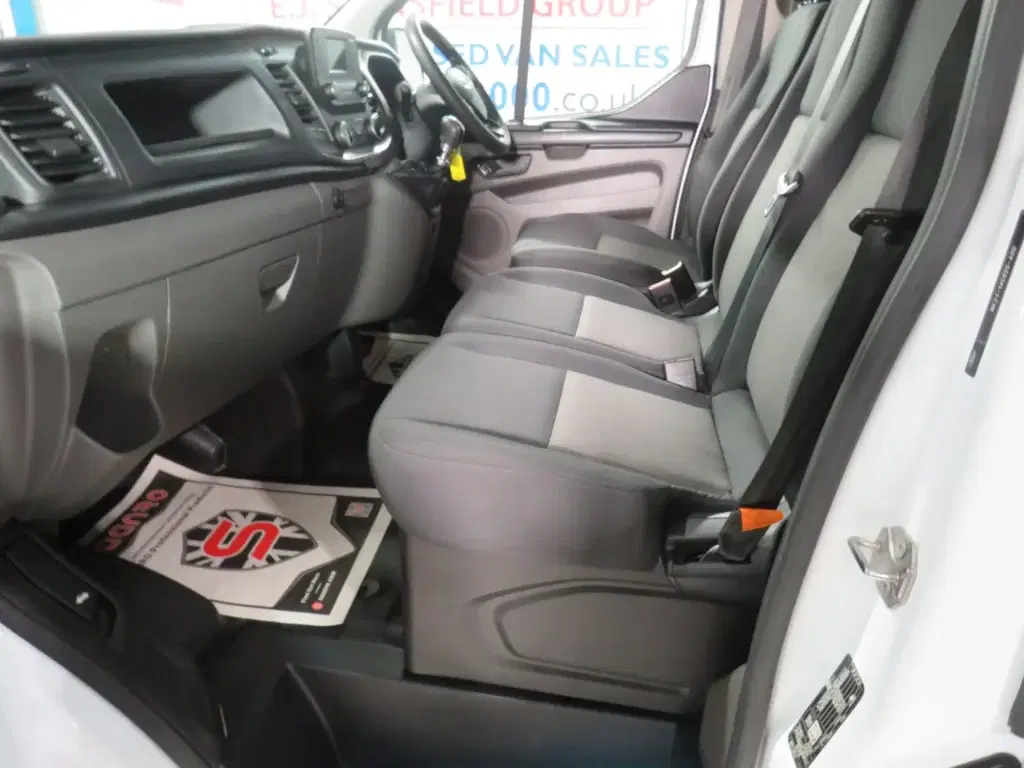 White Ford Transit Custom.