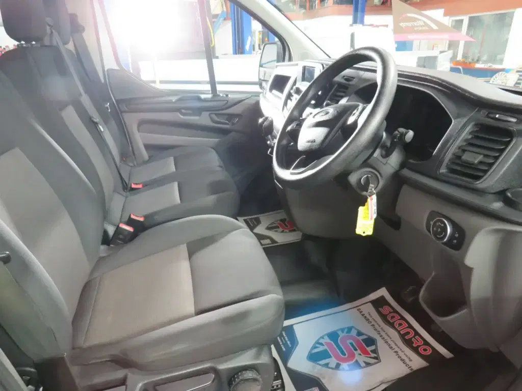 White Ford Transit Custom.