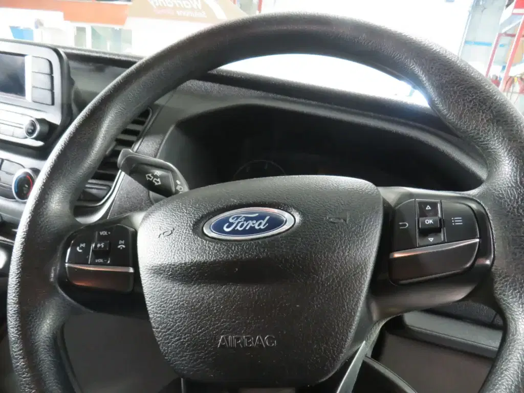 White Ford Transit Custom.