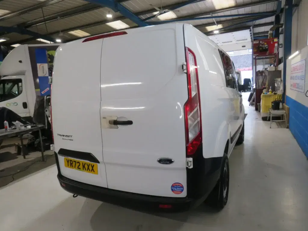 White Ford Transit Custom.