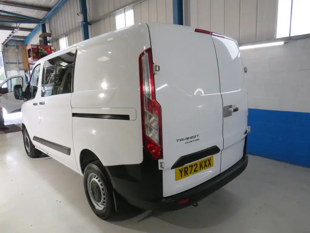 White Ford Transit Custom.