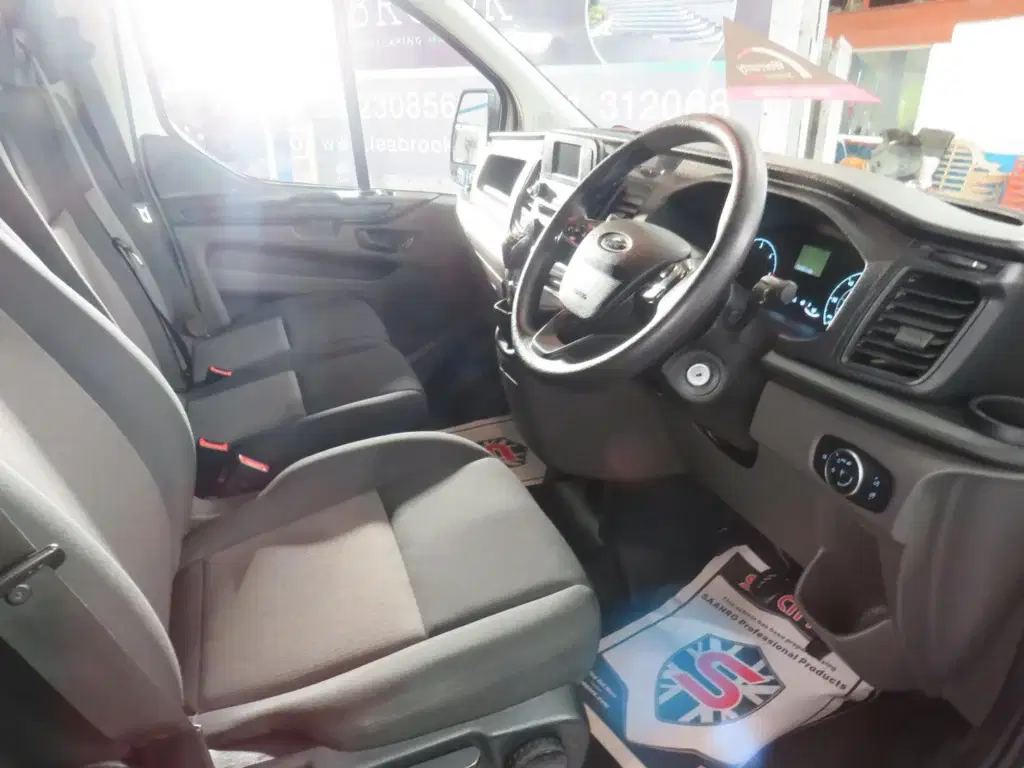 White Ford Transit Custom.