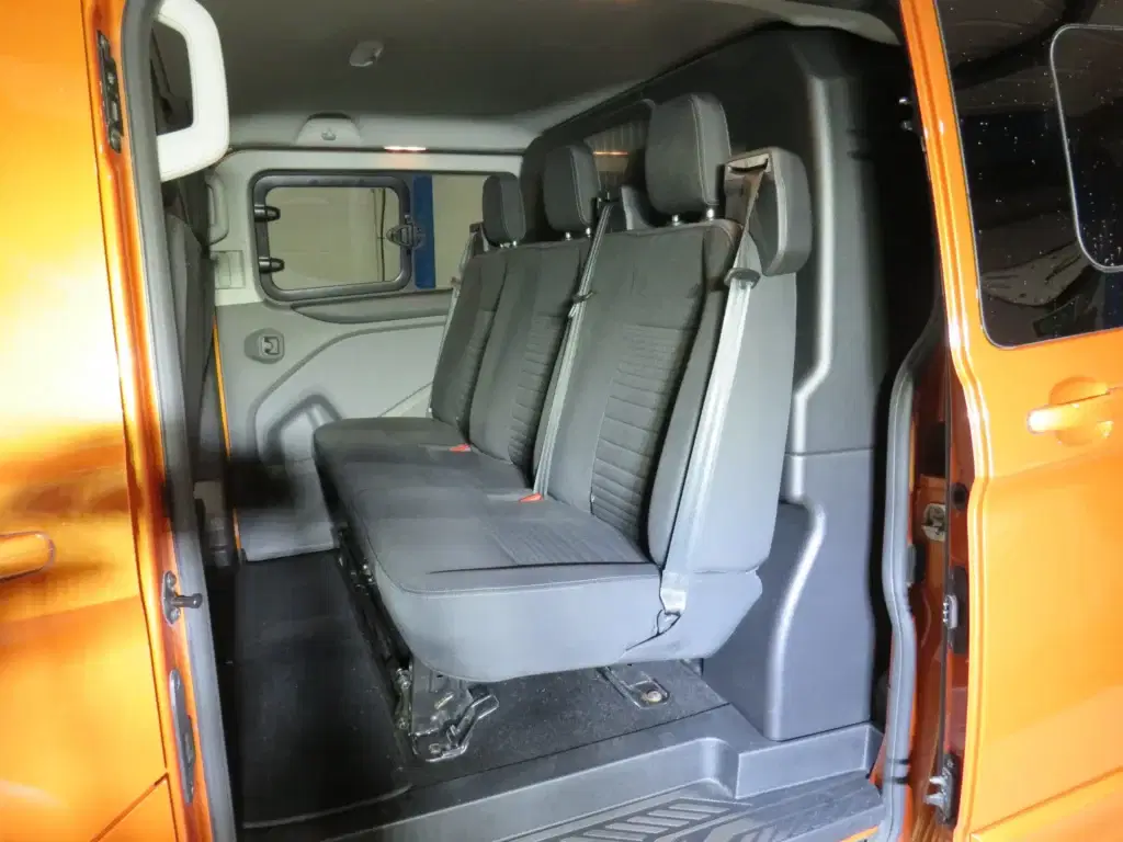 Orange golden Ford Transit Custom.