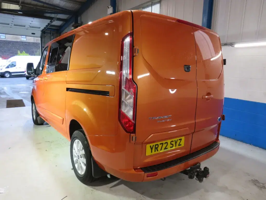 Orange golden Ford Transit Custom.