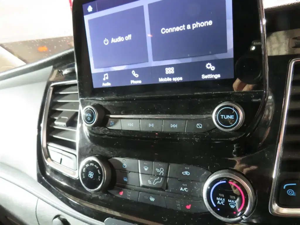 Orange golden Ford Transit Custom.